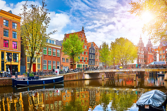 Historic buildings and canal in Amsterdam's historic center. Historic buildings and canal in Amsterdam's historic center.